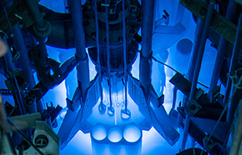 Photo of reactor with blue glow